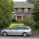 BMW E46 3-series Touring in front of a 1924 house